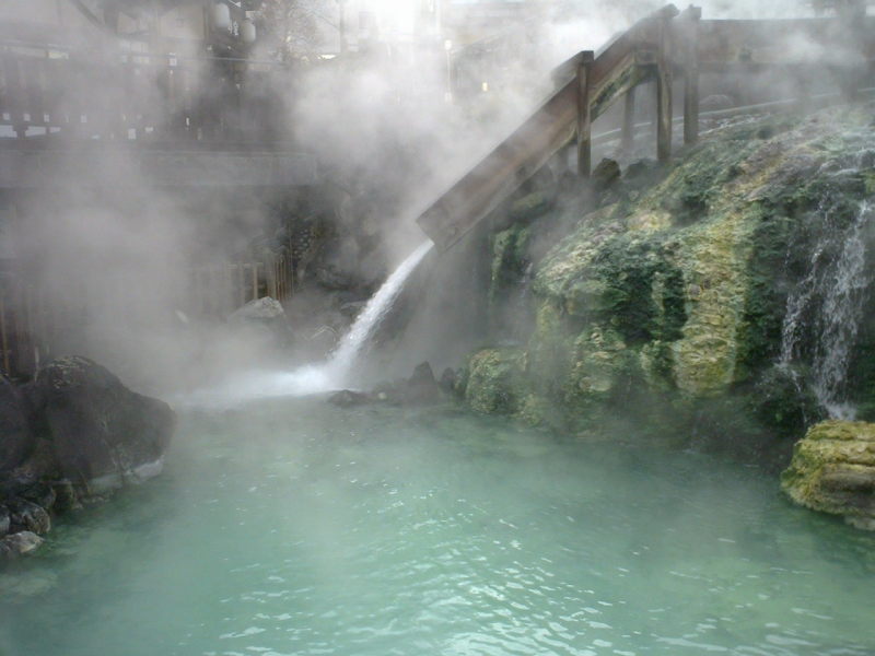Steam billows in the crisp morning air as water cascades out of the Yubatake.